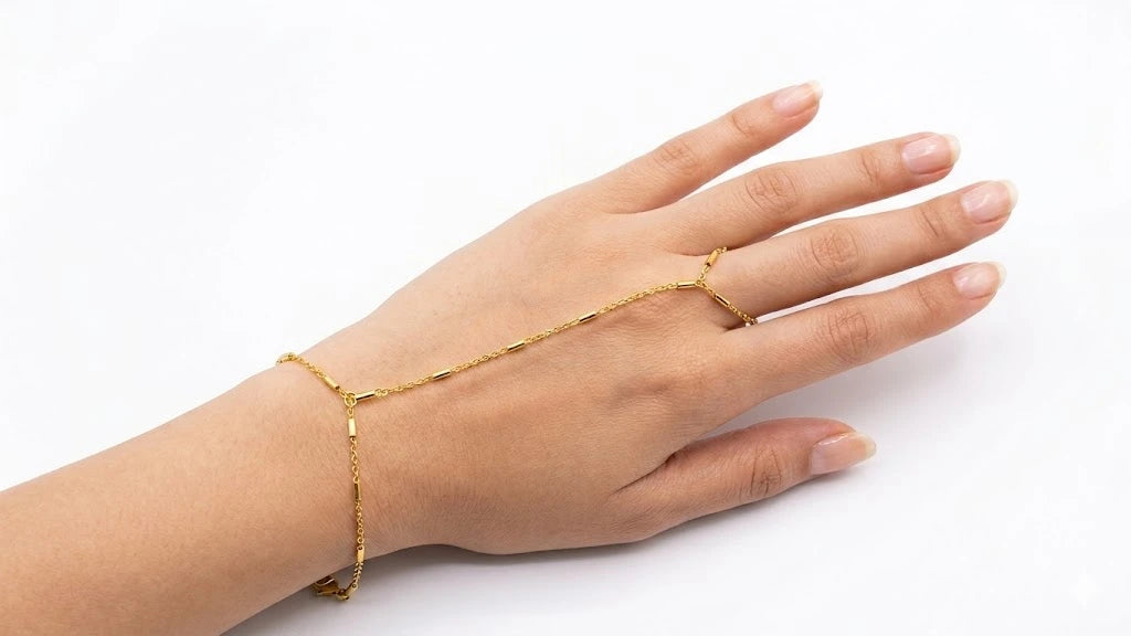 Gold hand chain on a white background